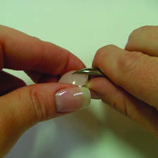 Hands holding the setting